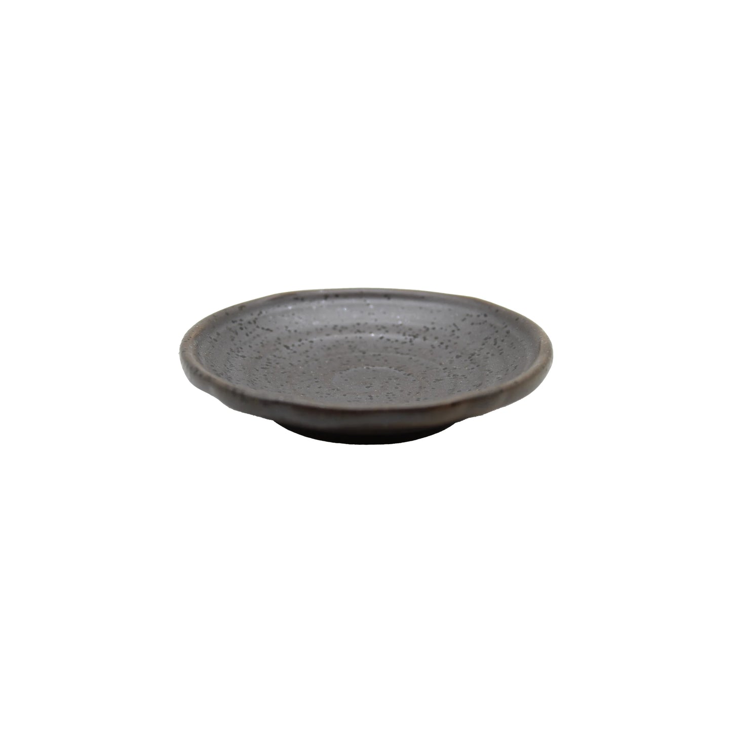 The Soy Sauce Dish - Black Iga Vortex is a shallow, round ceramic plate with a speckled gray texture, inspired by Iga-yaki pottery, displayed against a plain white background.