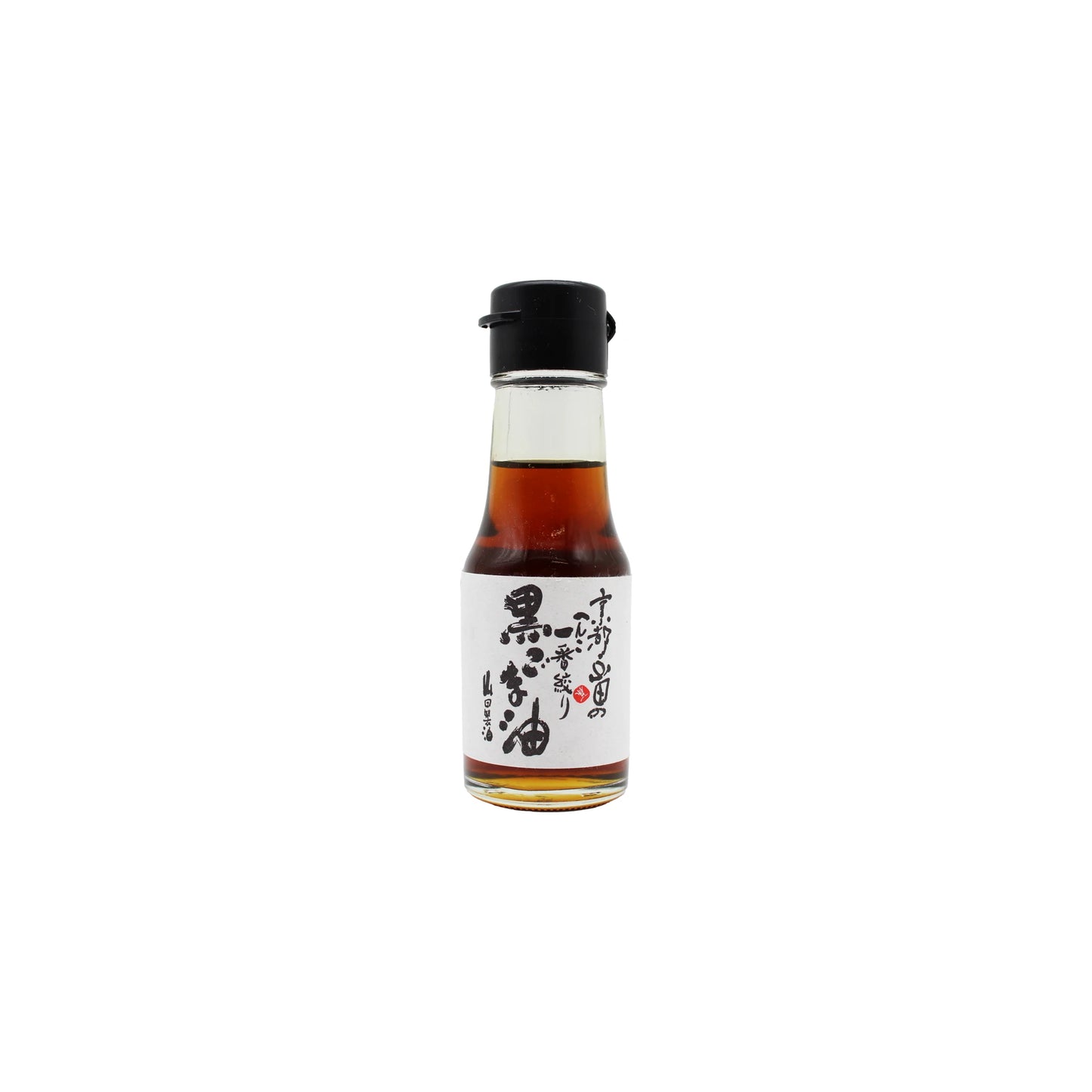 A small glass bottle with a black cap, filled with brown liquid and labeled in Japanese on white, contains high quality Black Sesame Oil from Yamada Seiyu.