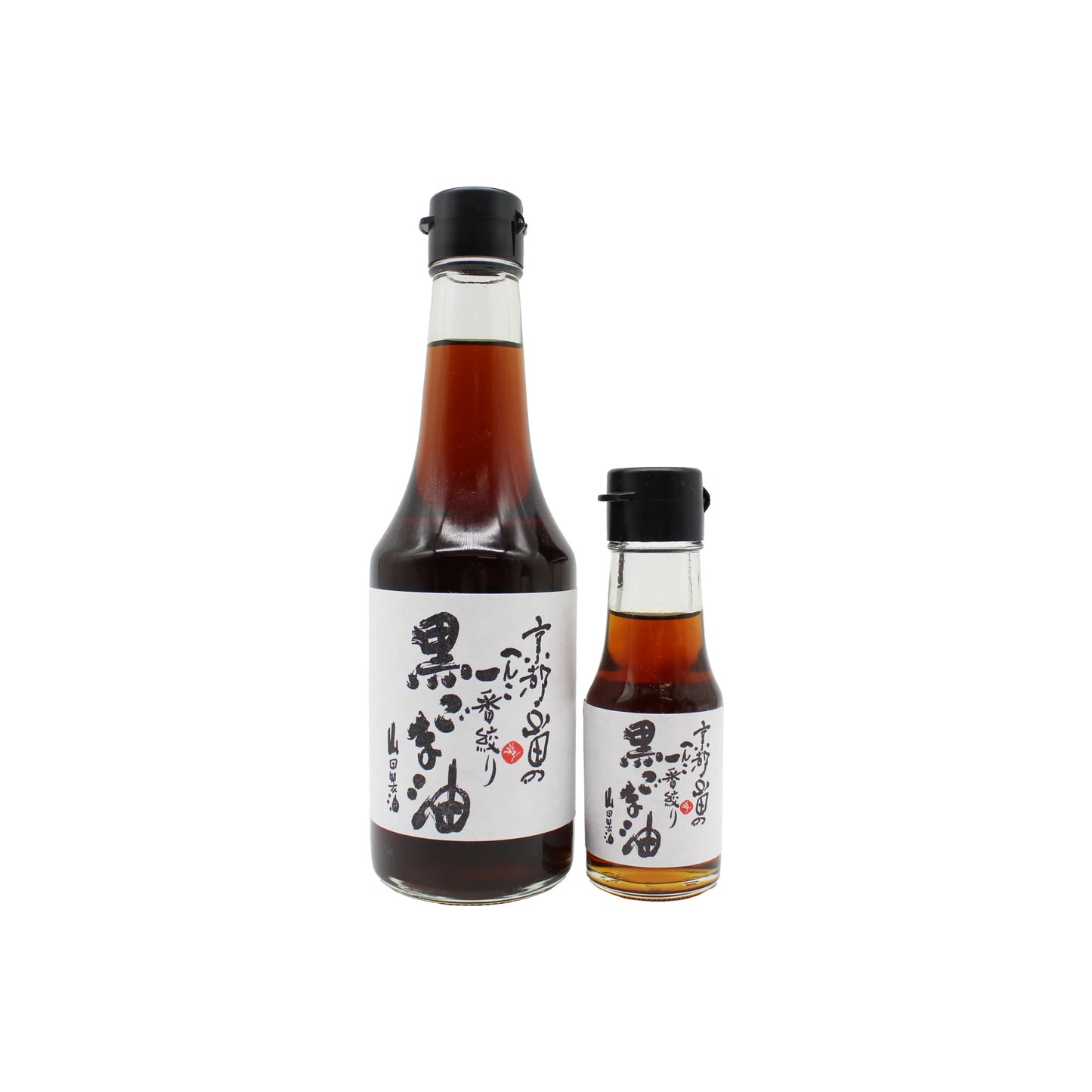 Two glass bottles of Yamada Seiyu Japanese soy sauce with black caps and white labels featuring Japanese text, displayed on a white background—perfect for pairing with their high quality Black Sesame Oil.