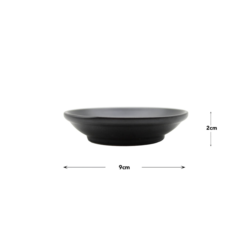 The Soy Sauce Dish - Matt Black measures 9 cm in diameter and 2 cm in height, making it perfect for serving soy sauce. It is shown against a plain white background.