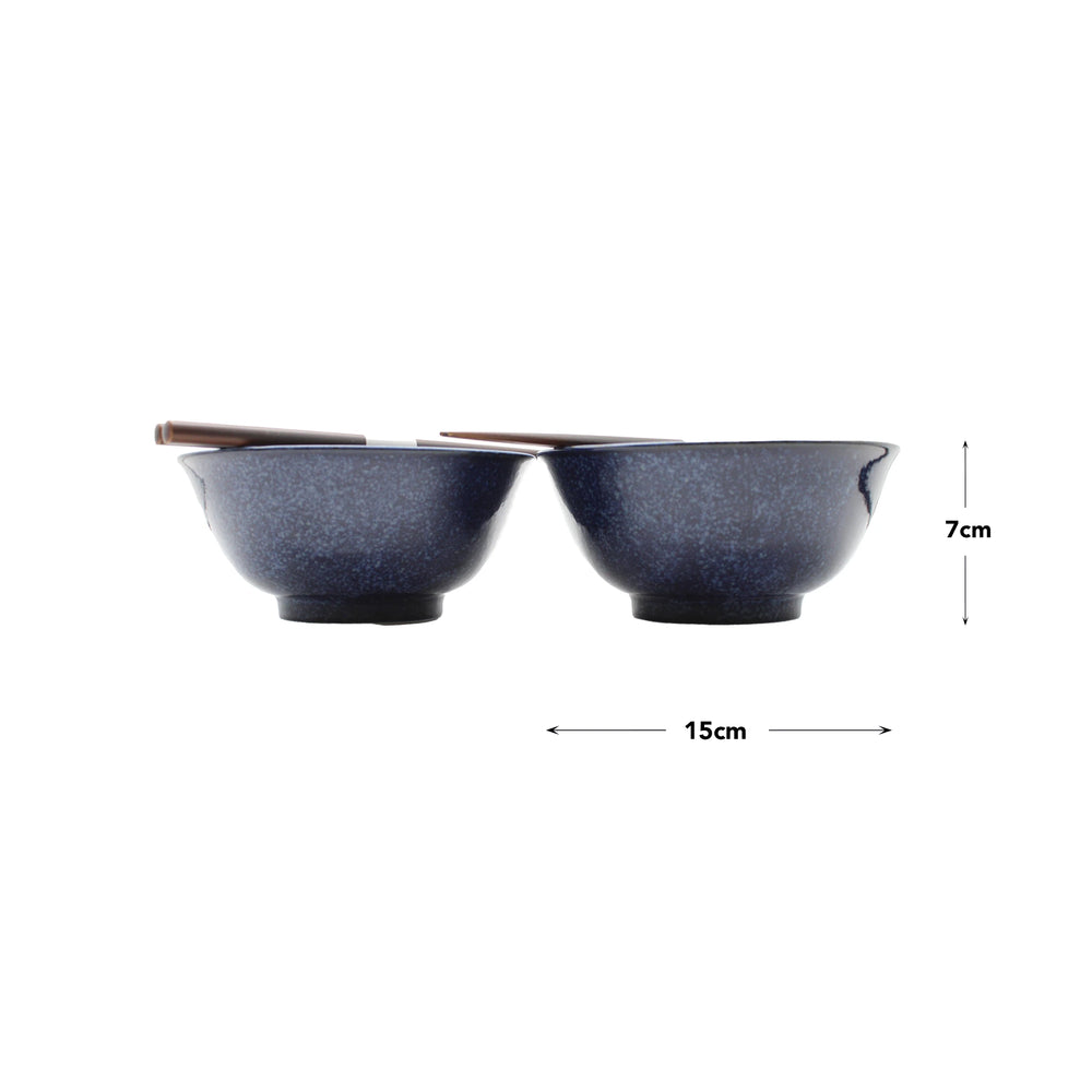 
                  
                    The Asanoha Flower Patterned Bowls Boxed Set in deep blue features two 15cm wide, 7cm tall Japanese Minoyaki porcelain bowls with chopsticks on top, displayed side by side on a white background.
                  
                