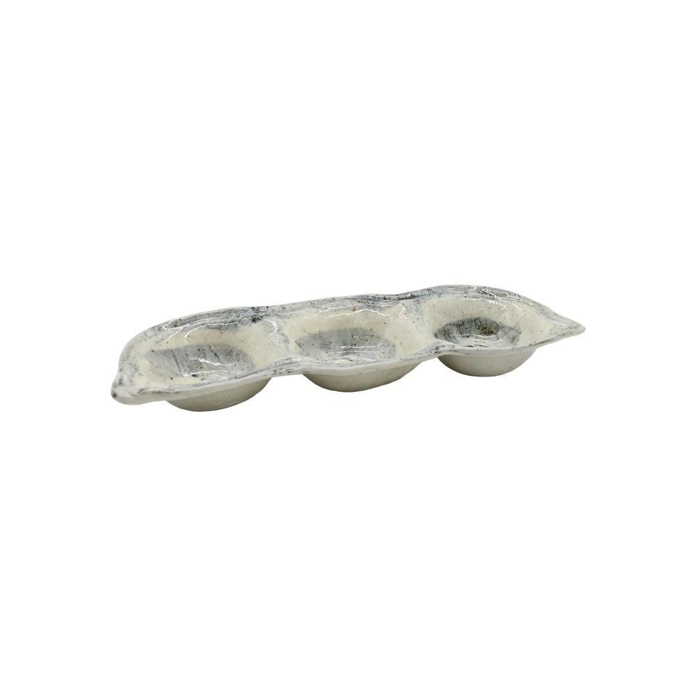 The Triple Sauce Dish - Blue and White, crafted from hand-finished Minoyaki porcelain in Japan, is displayed beside a three-cup aluminum muffin or cupcake baking tray on a white background.