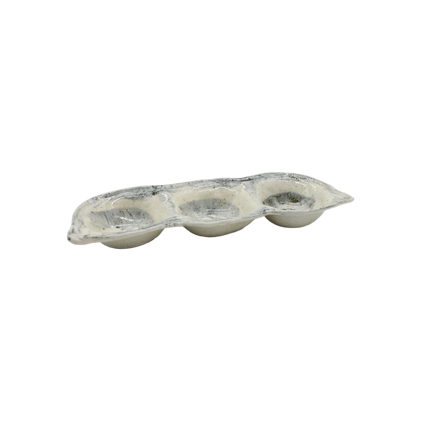 The Triple Sauce Dish - Blue and White, crafted from hand-finished Minoyaki porcelain in Japan, is displayed beside a three-cup aluminum muffin or cupcake baking tray on a white background.