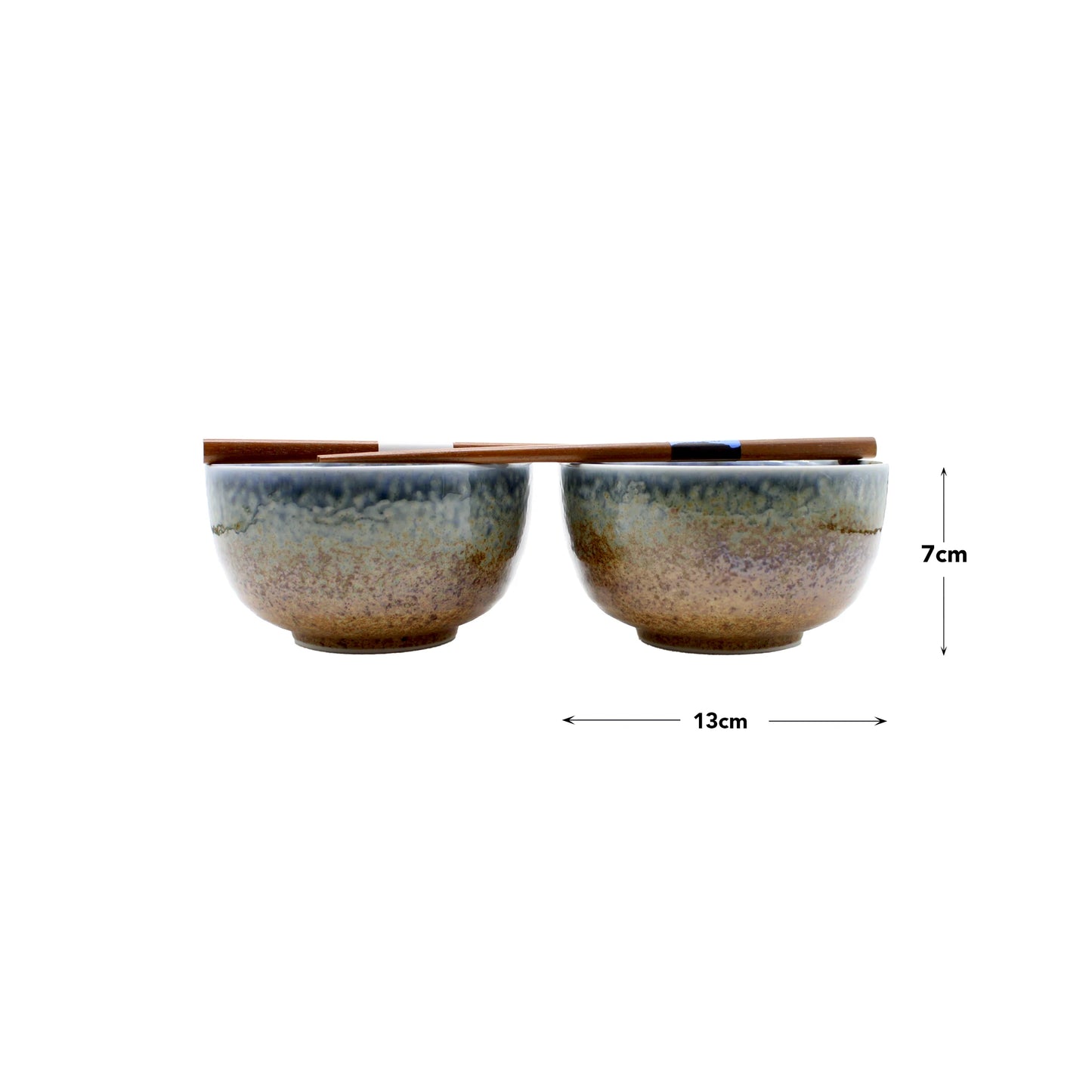 
                  
                    The Aki Bowl Gift Set - Brown & Blue includes two handmade Japanese bowls (7 cm tall, 13 cm wide) with a brown and blue gradient glaze, plus a pair of wooden chopsticks for an elegant rustic tableware set.
                  
                