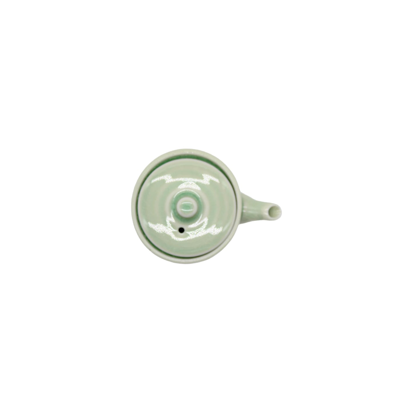 
                  
                    A top-down view of the Soy Sauce Pourer - Celadon Ribbed, a light green porcelain vessel with a side handle and spout, set against a plain white background.
                  
                