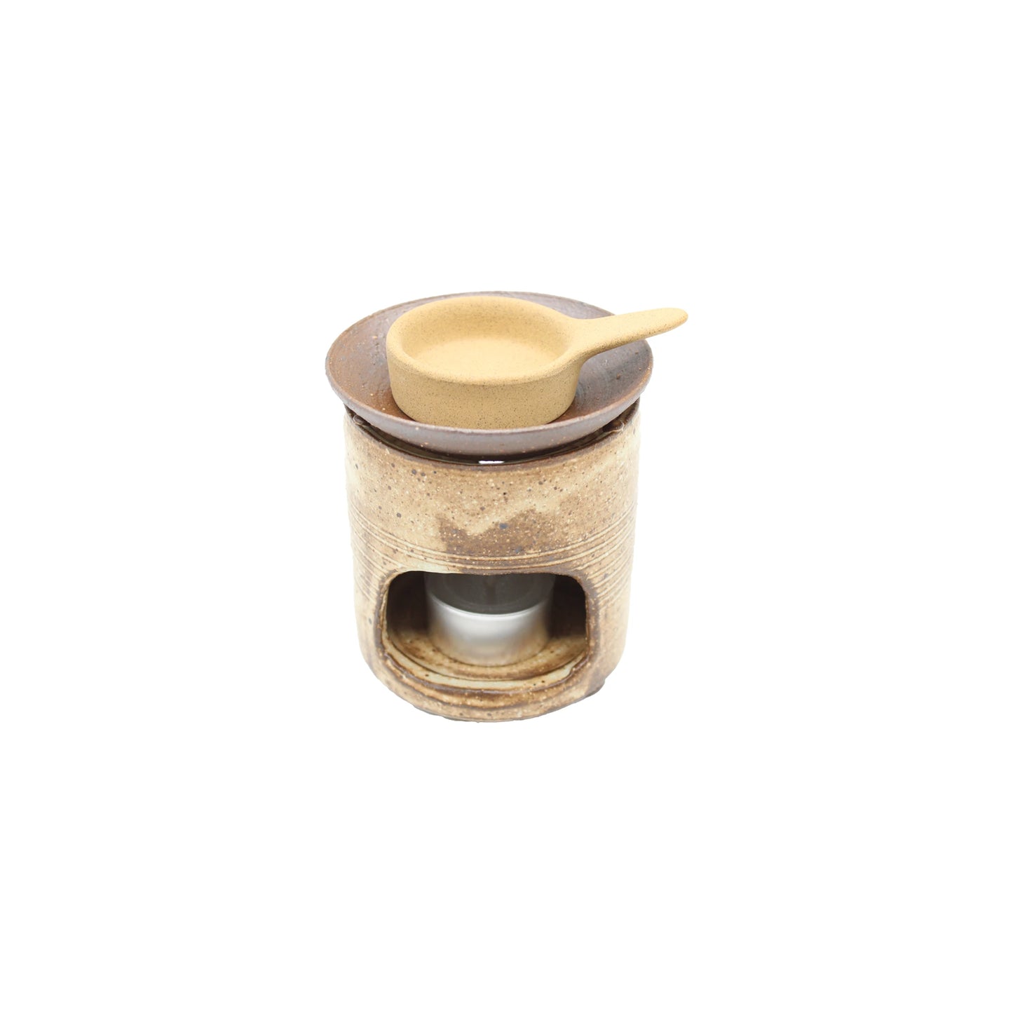 The Chakouro Rustic Brown Japanese Tea Burner is a small ceramic oil burner with a round dish and matching tan spoon, inspired by traditional Japanese design—ideal for use with a tealight candle.