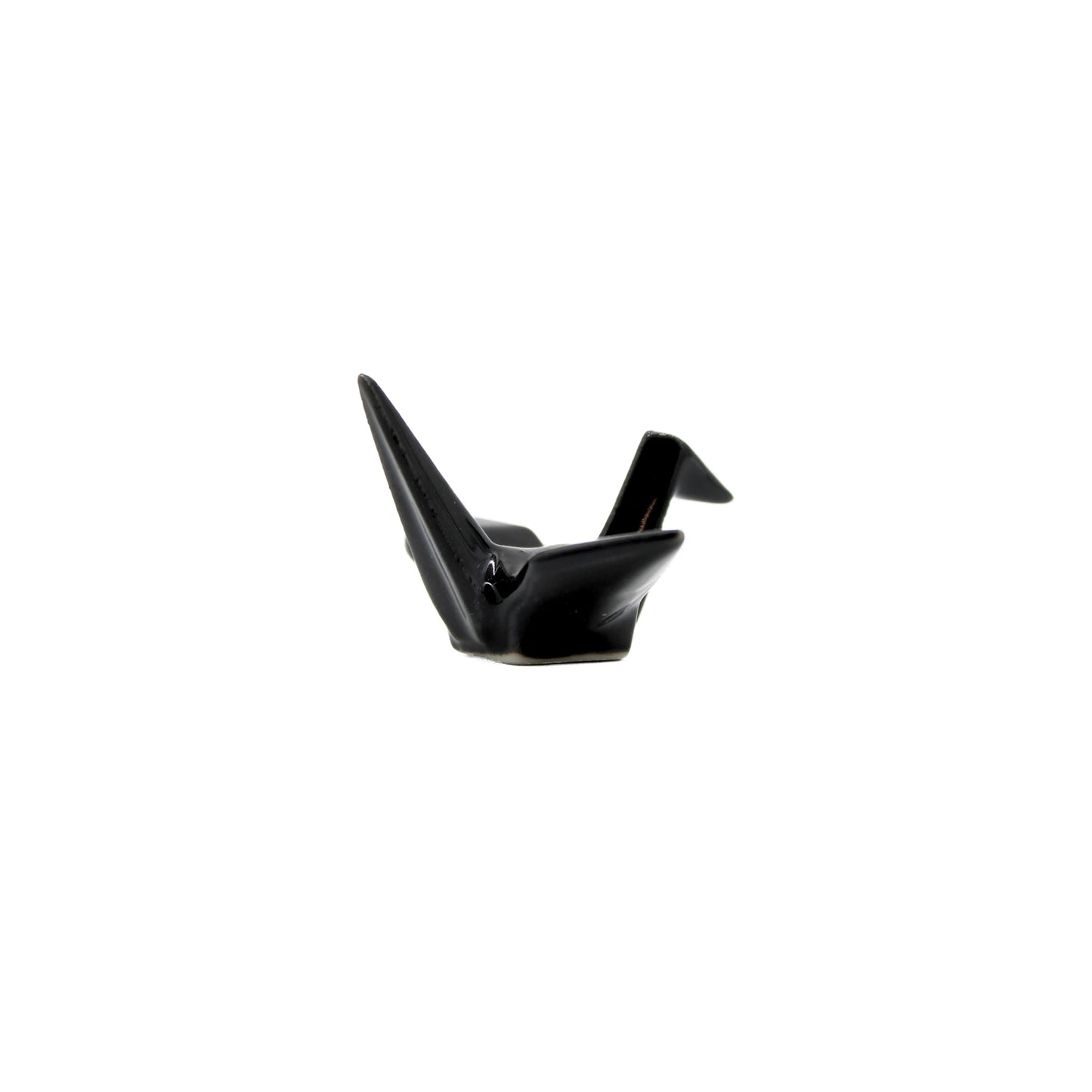 
                  
                    The Chopstick Rest - Origami Crane Black, inspired by Japanese culture, sits elegantly on a plain white background.
                  
                