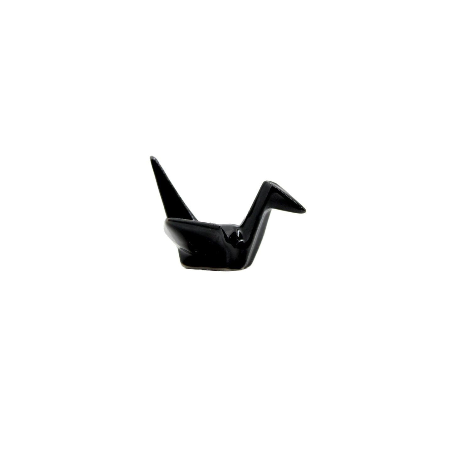 
                  
                    The Chopstick Rest - Origami Crane Black, inspired by Japanese culture, is a small black figurine elegantly displayed on a plain white background.
                  
                