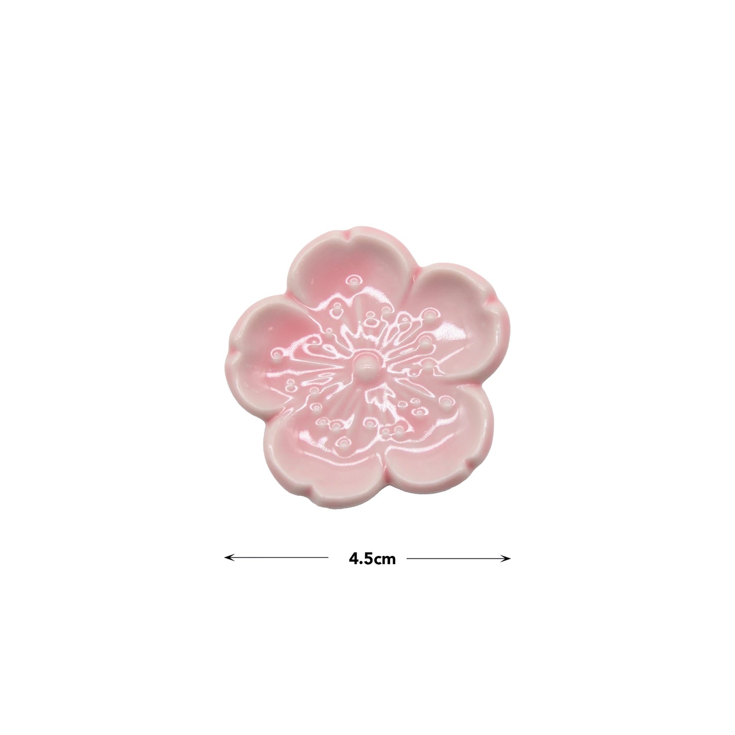 Chopstick Rest - Pink Sakura, made from Minoyaki porcelain, features a delicate white cherry blossom design at the center. Measuring 4.5 cm across, it’s an elegant addition to any Japanese tableware collection.