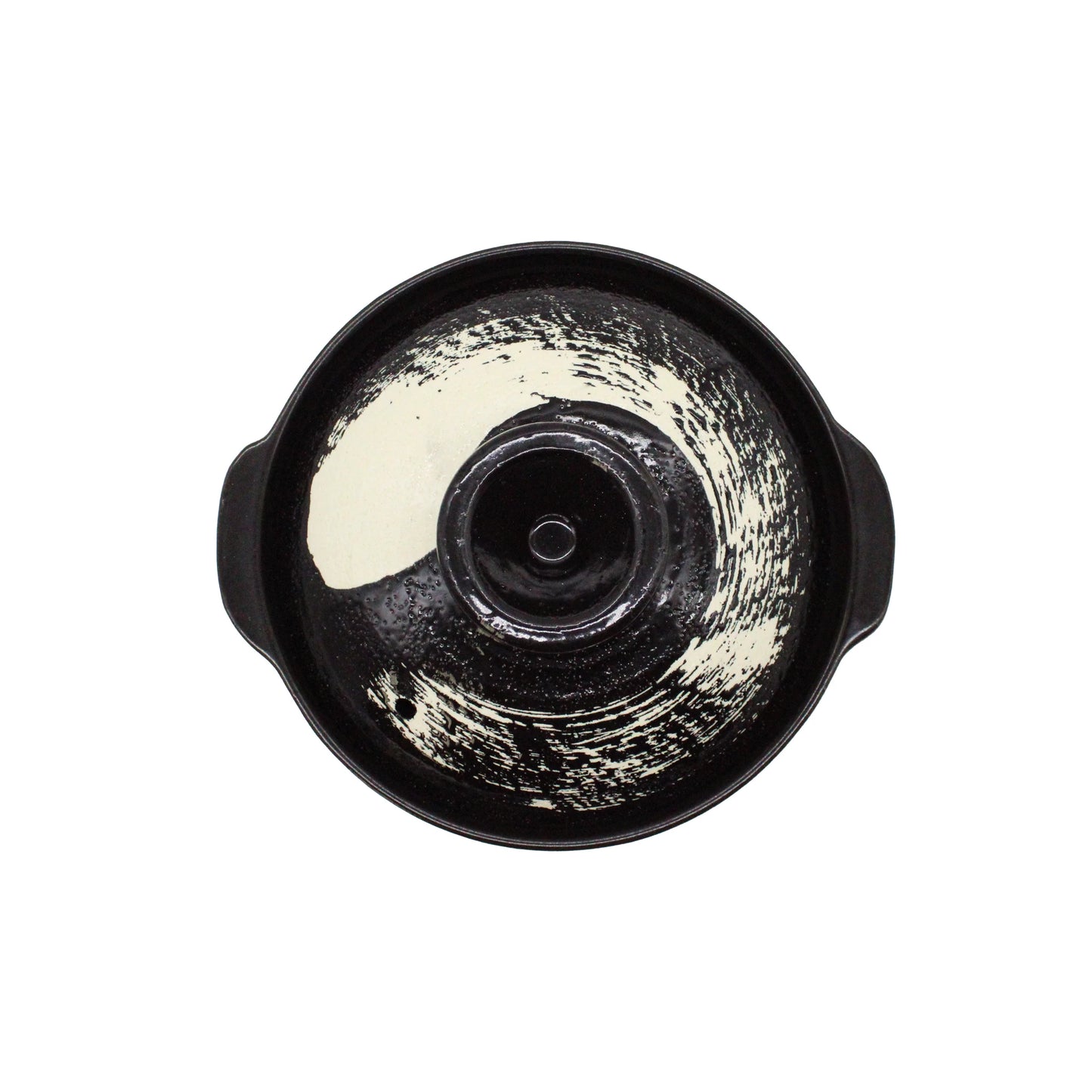 
                  
                    The Black Earthenware Donabe Pot with White Brushstroke Design is a two-handled, ceramic cooking pot seen from above, showcasing a circular white brushstroke inside.
                  
                
