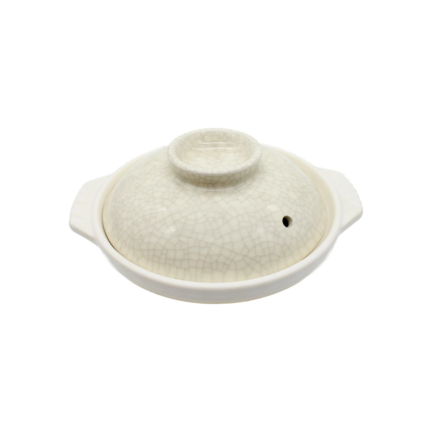 
                  
                    The Donabe Pot - Cream with Crackle Glaze features a lid, two side handles, and a small steam hole. Its subtle crackle glaze pattern stands out against a plain white background.
                  
                