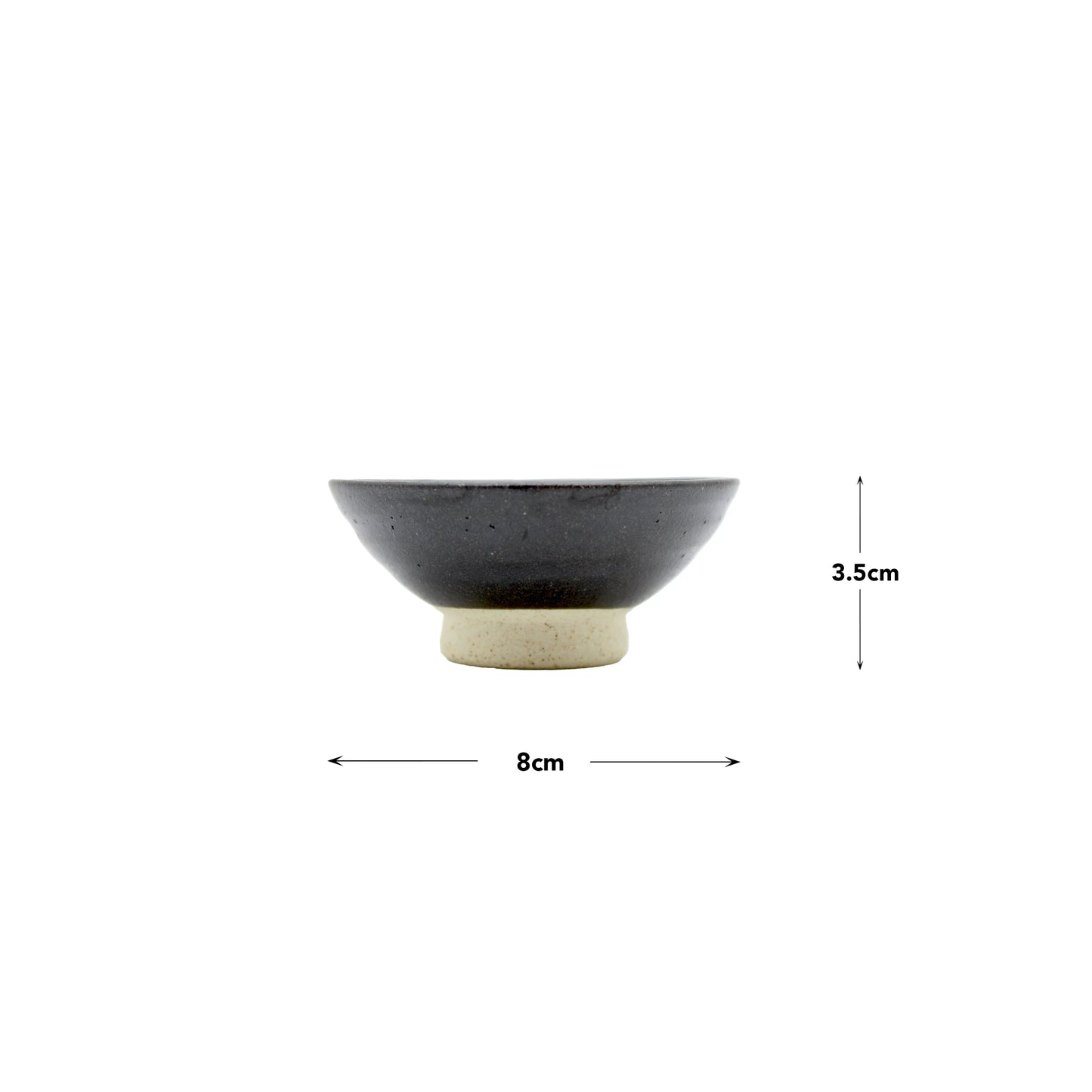 The Sake Cup - Flat Sakazuki in Black Iga Vortex is a small ceramic bowl with a dark upper section and light base, measuring 8 cm wide by 3.5 cm tall, displayed against a white background.