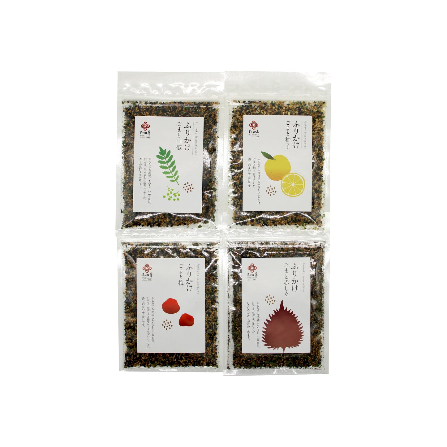 
                  
                    Four clear packets of the Wadaman Furikake Set, each featuring a unique illustrated ingredient—green herb, lemon, red fruit, and red leaf—are displayed on a white background. This vibrant Japanese seasoning set is perfect for adding flavorful variety to your rice dishes.
                  
                