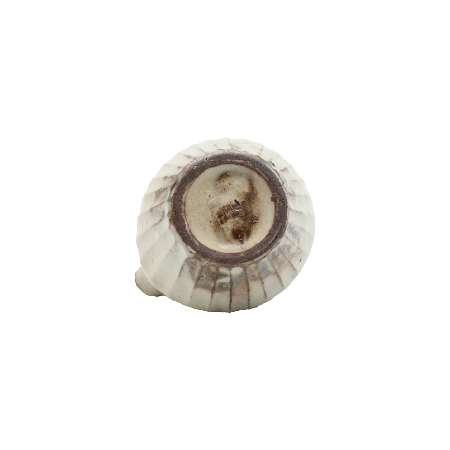 
                  
                    The Pourer - Iron Scatter features a round ceramic shape with vertical ridges, a rustic unglazed base, and central metal attachment point—crafted in the Shigaraki pottery style.
                  
                