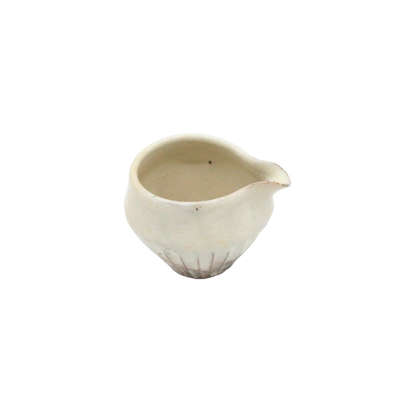 
                  
                    The Pourer - Iron Scatter is a small, white ceramic vessel with a spout, inspired by Shigaraki pottery. It features a round base and gently textured surface, blending timeless elegance with traditional craftsmanship.
                  
                