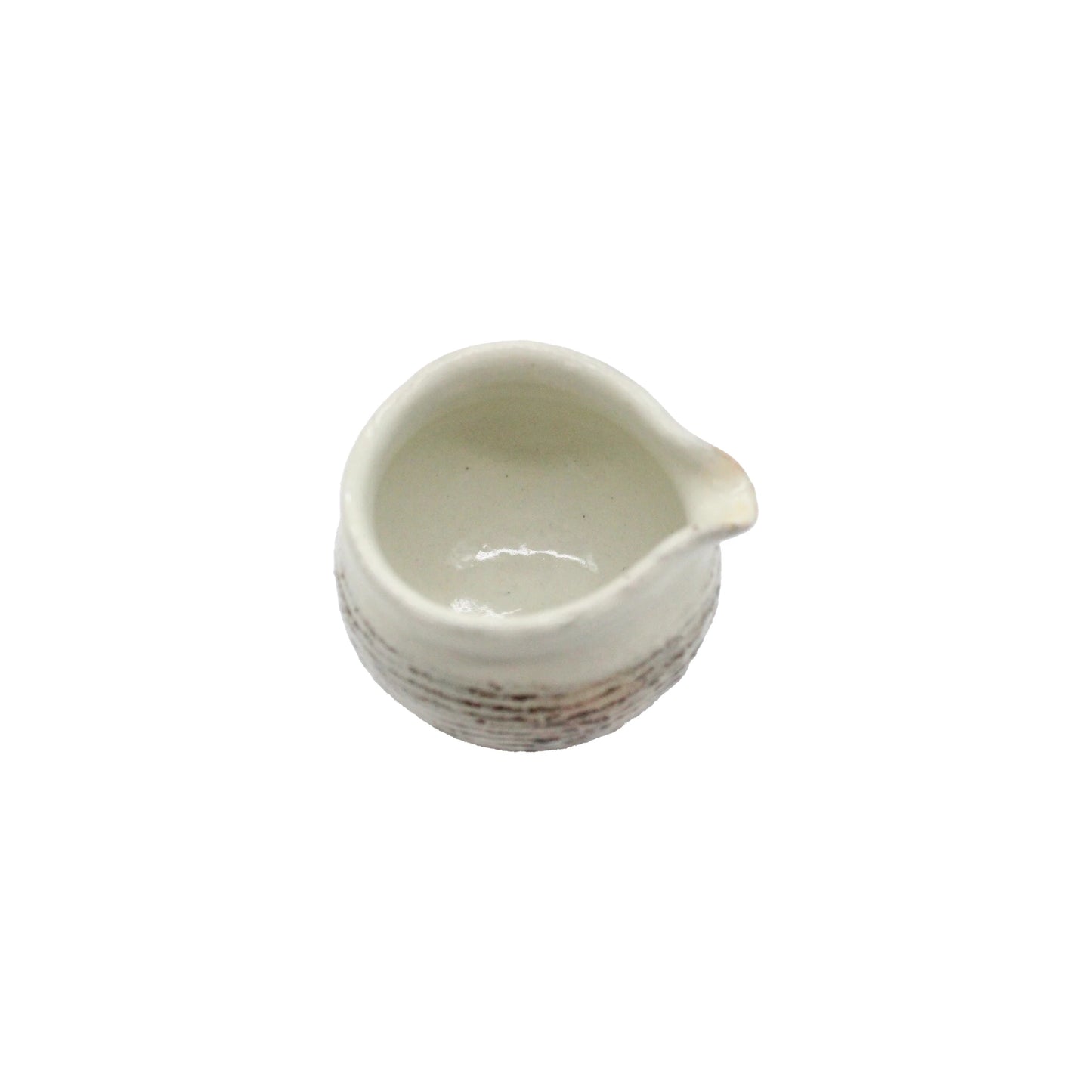 The Fuchiara Carved Pourer is a white ceramic Japanese pourer with a spout, crafted in the Shigaraki pottery style and shown from above against a plain white background.