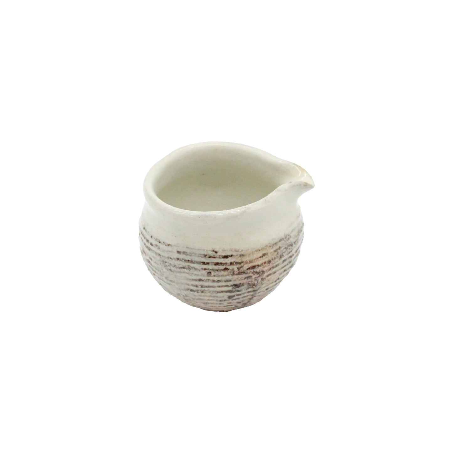 
                  
                    The Pourer - Fuchiara Carved is a small, round ceramic piece with a textured lower half and spout, crafted in the Shigaraki style, displayed against a plain white background.
                  
                