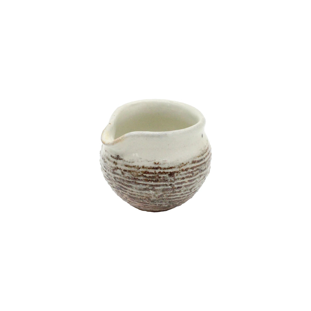 The Pourer - Fuchiara Carved is a small ceramic Japanese vessel with a rounded body, carved brown and white texture, and spout in Shigaraki pottery style, shown against a plain white background.