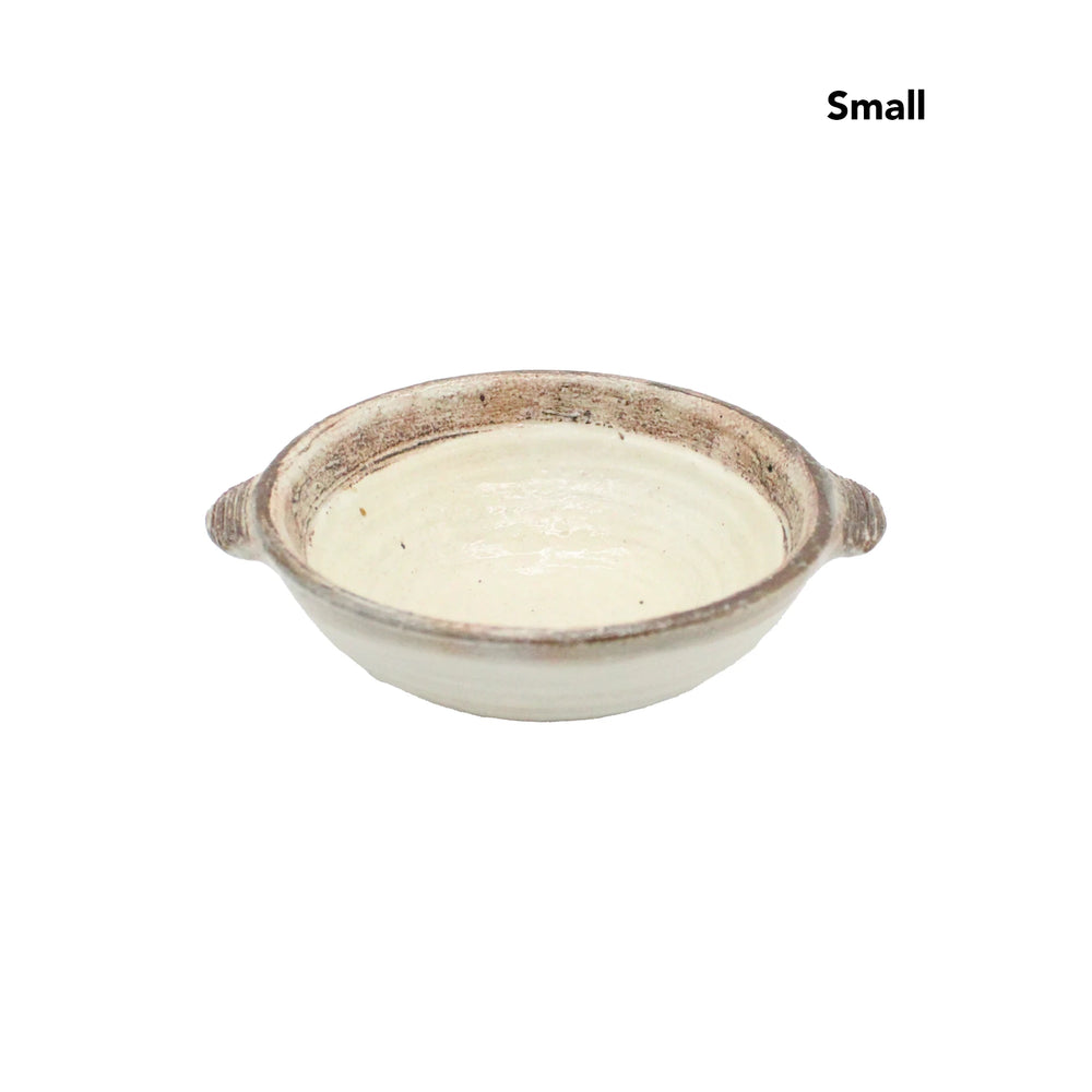 
                  
                    The Ear Bowls - Fuchiara Carved are small ceramic bowls with two side handles, a neutral glaze, and a rustic Kohiki finish. Small appears in the top right corner, reflecting the timeless style of Japanese ceramic bowls.
                  
                