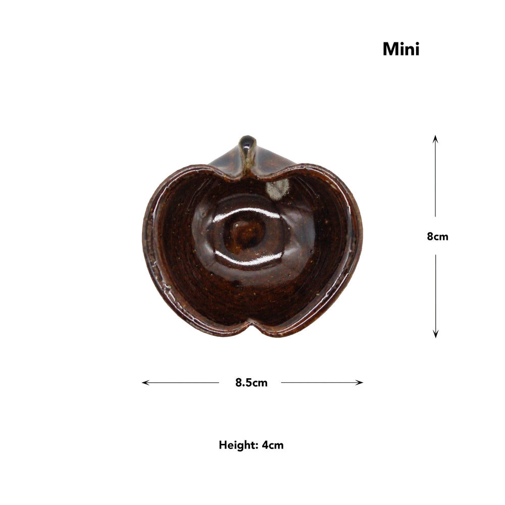 
                  
                    Apple Bowls - Candy Glaze: Heart-shaped mini brown ceramic bowl inspired by Japanese pottery, shown from above with labeled dimensions—8.5 cm wide, 8 cm tall, and 4 cm high.
                  
                
