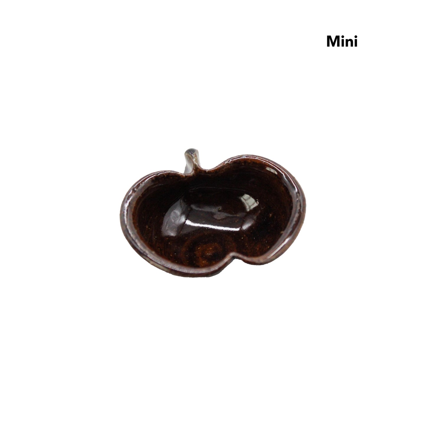 
                  
                    Small, brown, glossy ceramic dish shaped like an apple, viewed from above, with “Mini” in the corner. A charming Apple Bowls - Candy Glaze piece inspired by Japanese Shigaraki pottery.
                  
                