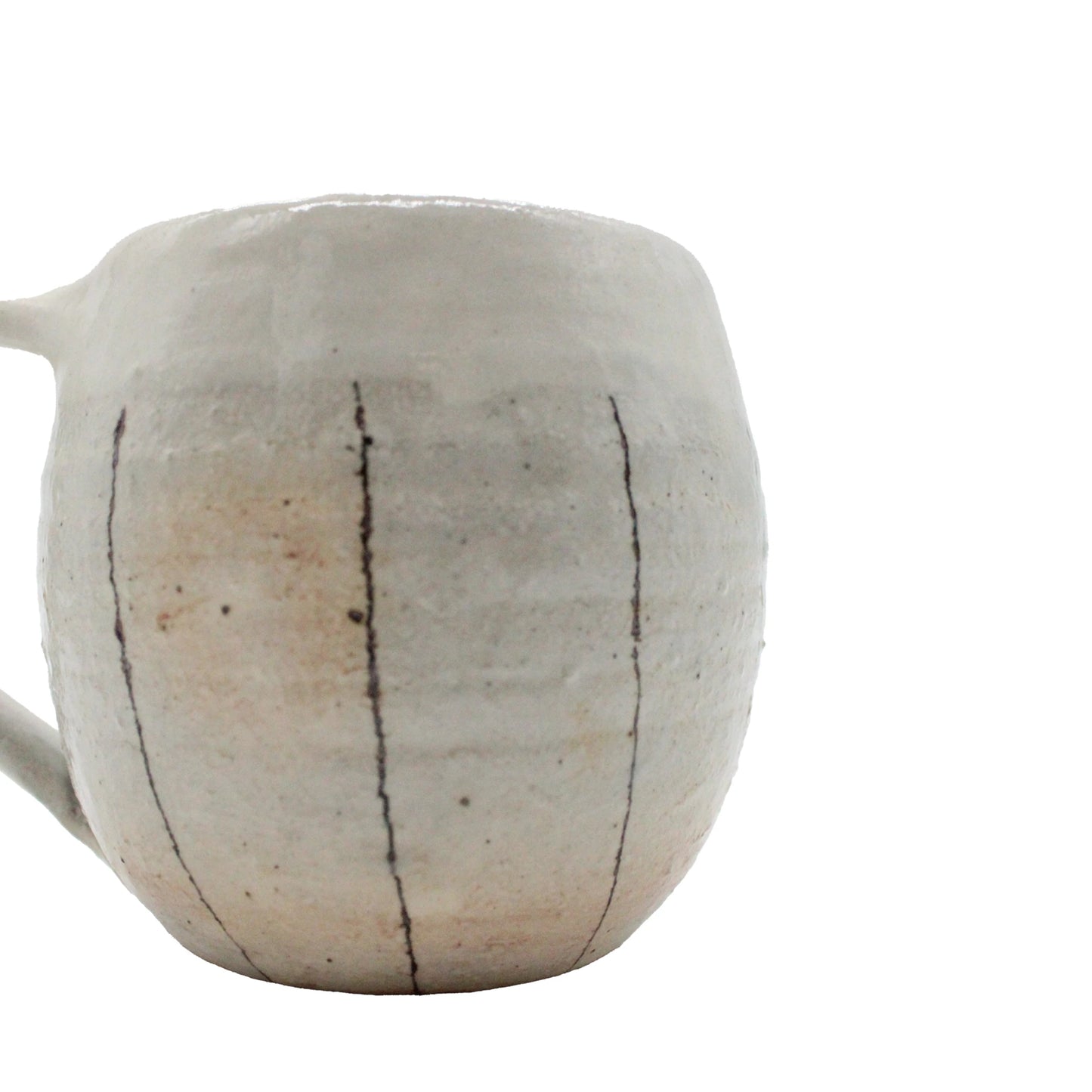 
                  
                    The Tea Mug with Handle - Iron Wire is a handmade ceramic mug inspired by Japanese Shigaraki pottery, featuring a matte off-white finish, visible ridges, and vertical black lines for a traditional look.
                  
                