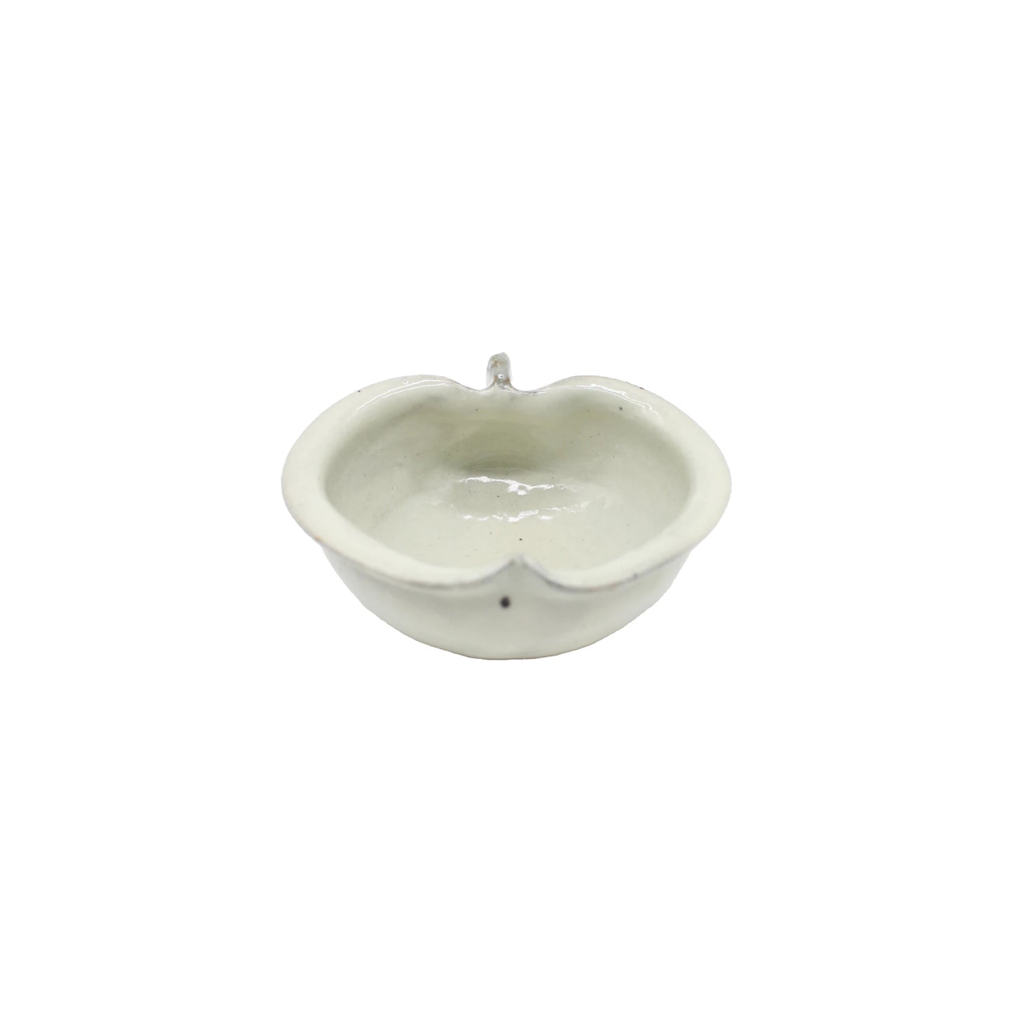 
                  
                    The Apple Bowl - Iron Spot is a small, white Japanese ceramic bowl with a rounded, slightly irregular apple-like shape and a subtle protruding detail on one side, shown against a plain white background.
                  
                
