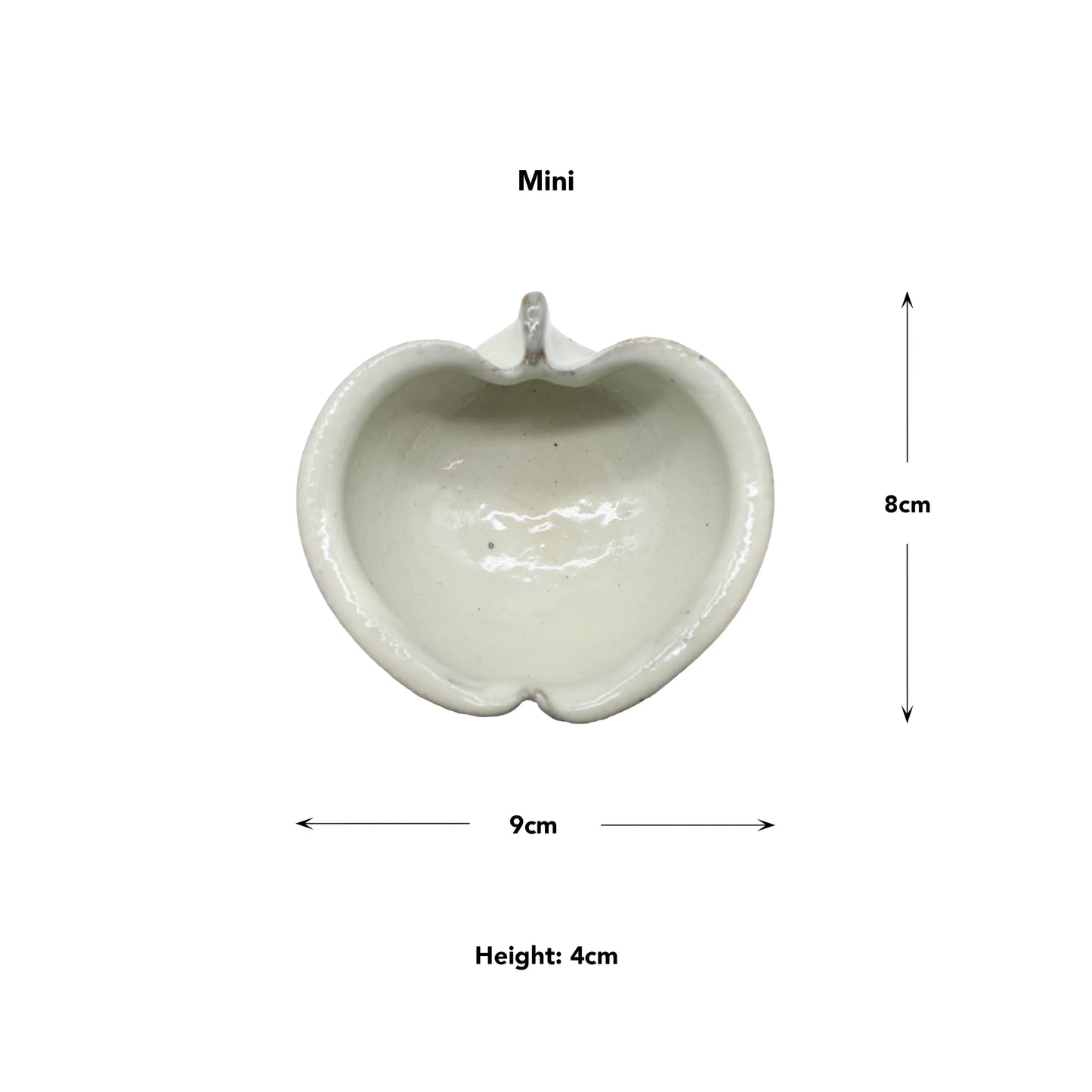 
                  
                    The Apple Bowl - Iron Spot is a Mini bowl made from Japanese ceramic, apple-shaped, and measures 9 cm wide, 8 cm tall, and 4 cm high. Measurement arrows are shown.
                  
                