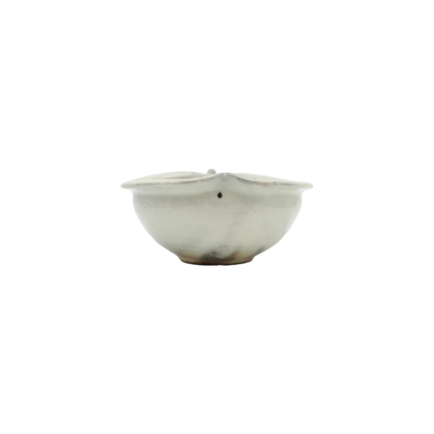 
                  
                    The Apple Bowl - Iron Spot is a small, round Japanese ceramic bowl featuring a light off-white glaze and a slightly uneven rim, displayed against a plain white background.
                  
                