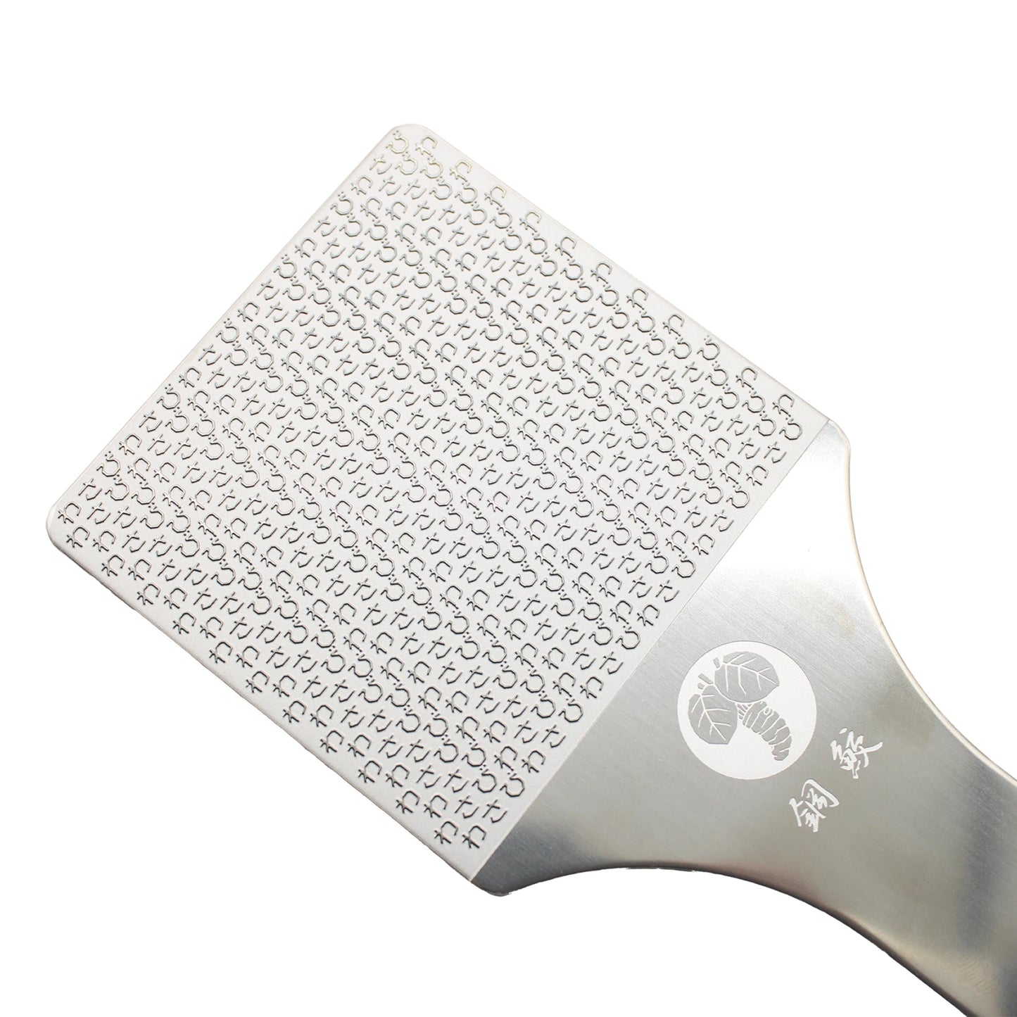 A close-up of the Hagane-zame Wasabi Graters, featuring fine, sharp stainless-steel etched blades and a lobster logo engraved on the handle.