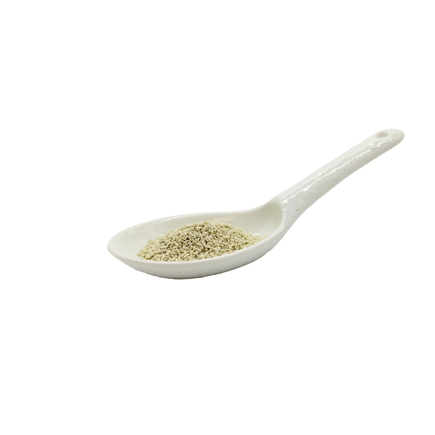 
                  
                    A white ceramic spoon contains a small amount of Shinmaya Kombu Dashi Powder, a light beige seasoning known for its plant-based umami flavor, isolated on a white background.
                  
                