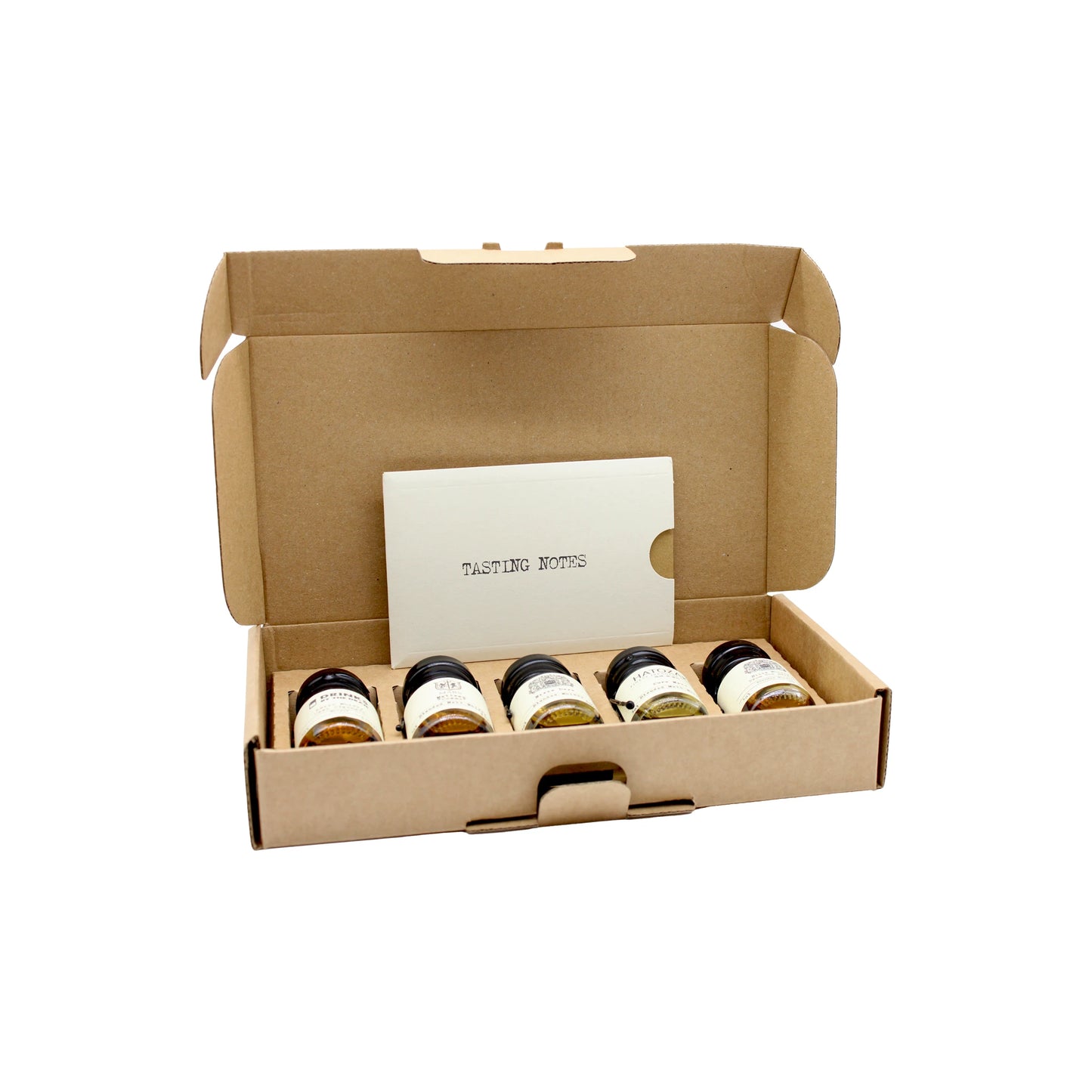
                  
                    The Japanese Whisky Tasting Set features five labeled mini jars and a Tasting Notes card, all neatly packed in a cardboard box—an ideal introduction to whisky styles, shown against a white background.
                  
                