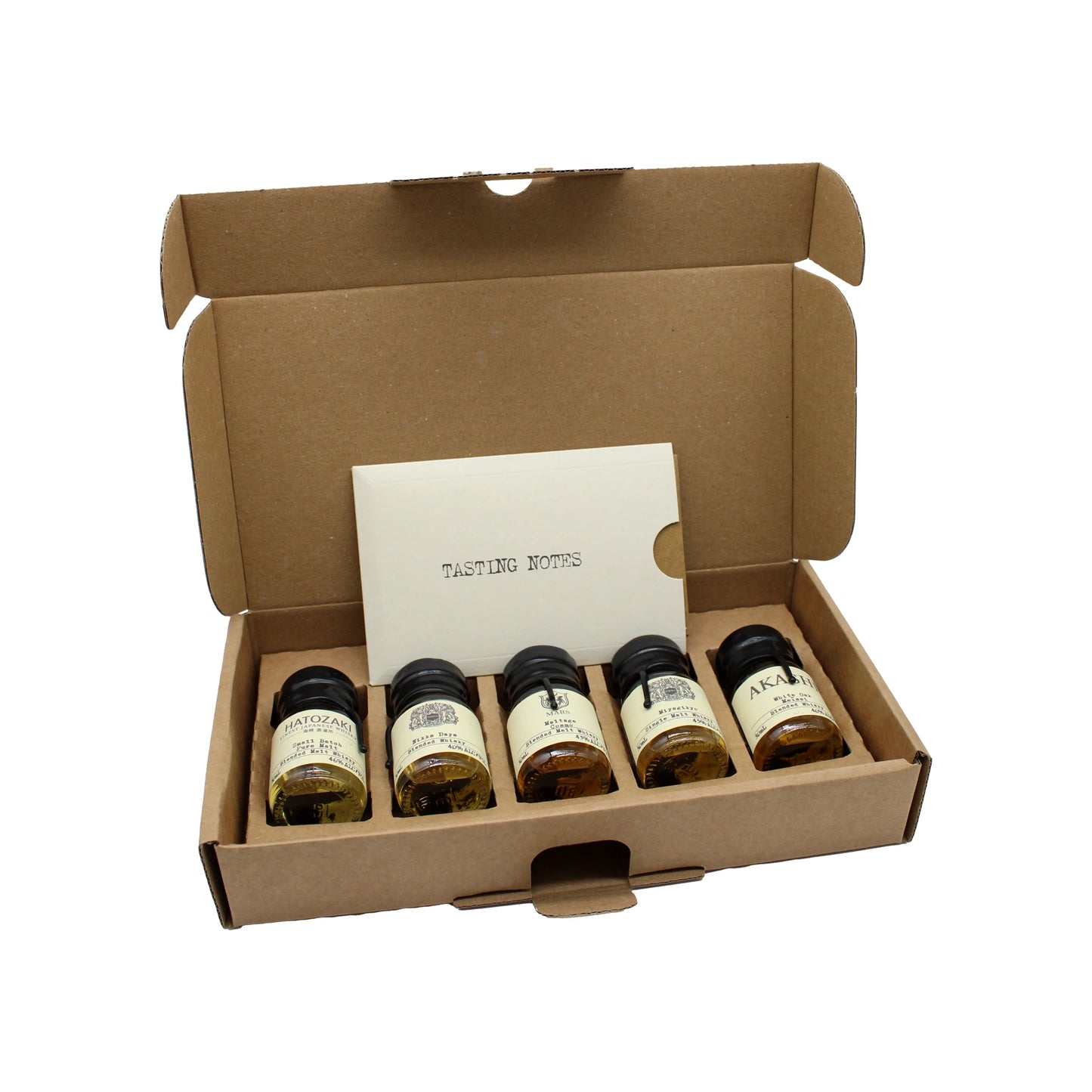 
                  
                    The Japanese Whisky Tasting Set includes five small labeled bottles in a cardboard box with a folded Tasting Notes paper—ideal for a memorable whisky tasting experience.
                  
                