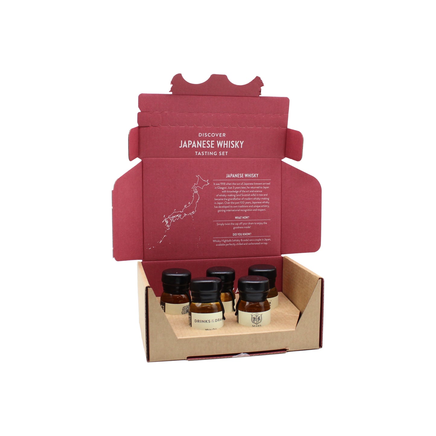 The Japanese Whisky Discovery Tasting Set features five small labeled whisky bottles in a cardboard box with a maroon insert detailing an immersive Japanese whisky tasting experience.