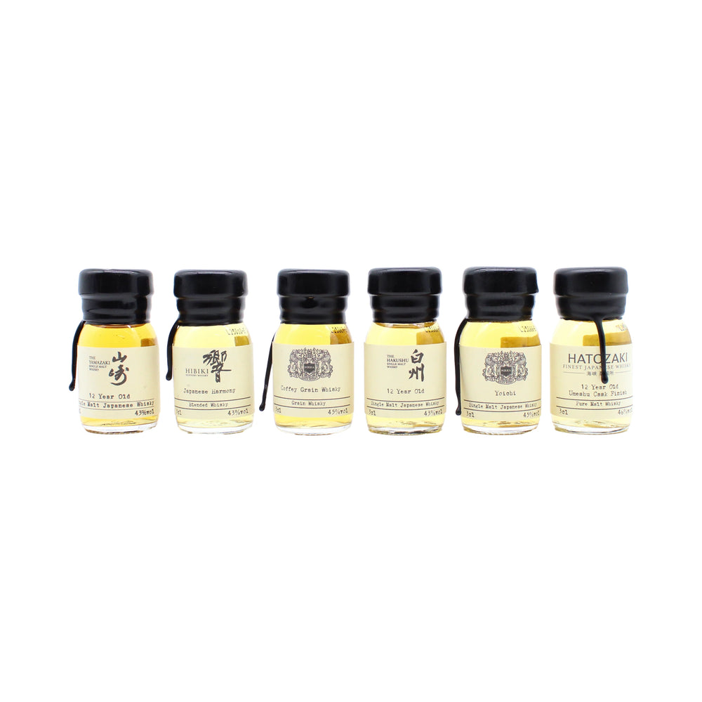 
                  
                    The Japanese Whisky Premium Tasting Set features six small bottles of Japanese whisky with distinct labels and golden hues, including Yamazaki 12 Year Old, all arranged in a row against a white background.
                  
                