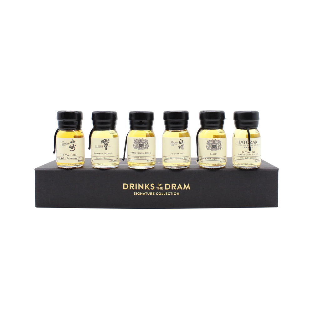 Six small glass whisky bottles are arranged on a black display stand labeled The Japanese Whisky Premium Tasting Set, making it the ideal choice for those eager to sample fine Japanese whiskies like Yamazaki 12 Year Old.