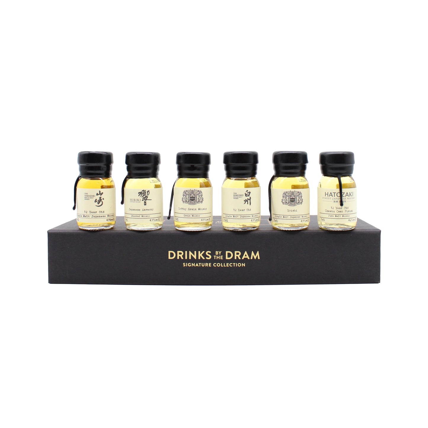 Six small glass whisky bottles are arranged on a black display stand labeled The Japanese Whisky Premium Tasting Set, making it the ideal choice for those eager to sample fine Japanese whiskies like Yamazaki 12 Year Old.