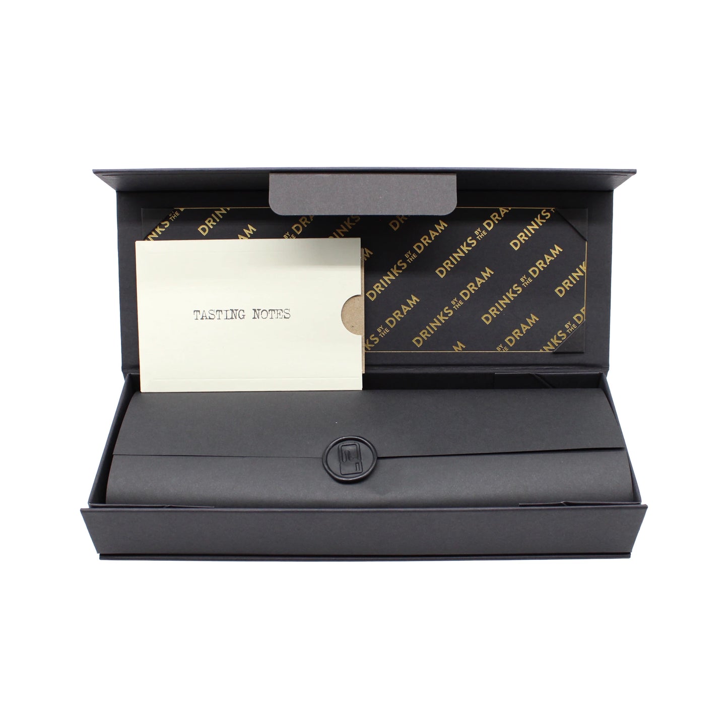 
                  
                    The Japanese Whisky Premium Tasting Set features a black gift box lined with DRINKS BY THE DRAM, a folded black envelope sealed with a sticker, and a TASTING NOTES card—ideal for exploring Japanese whisky or gifting as an elegant tasting set.
                  
                