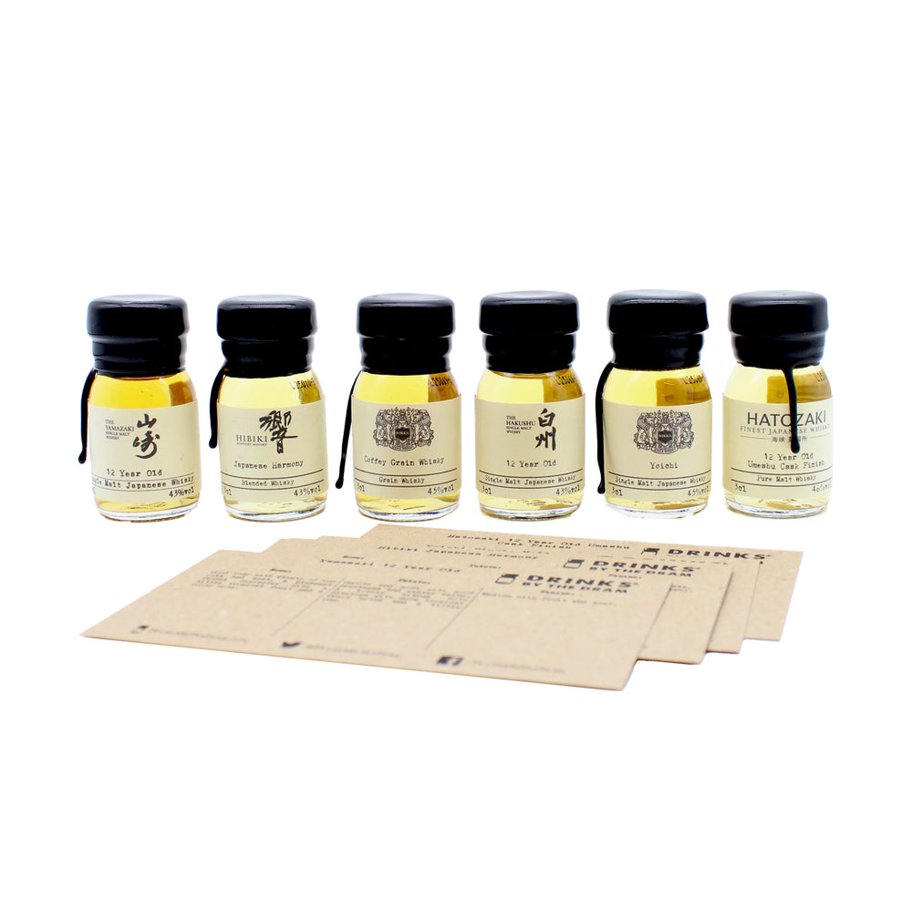
                  
                    The Japanese Whisky Premium Tasting Set features six small bottles of whisky, including Yamazaki 12 Year Old, lined up behind three brown tasting cards on a white background for an inviting tasting experience.
                  
                