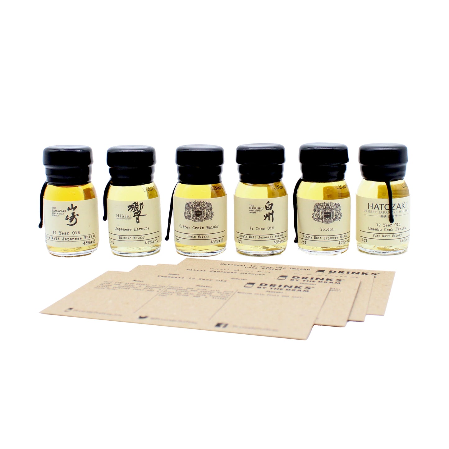 
                  
                    The Japanese Whisky Premium Tasting Set features six small bottles of whisky, including Yamazaki 12 Year Old, lined up behind three brown tasting cards on a white background for an inviting tasting experience.
                  
                