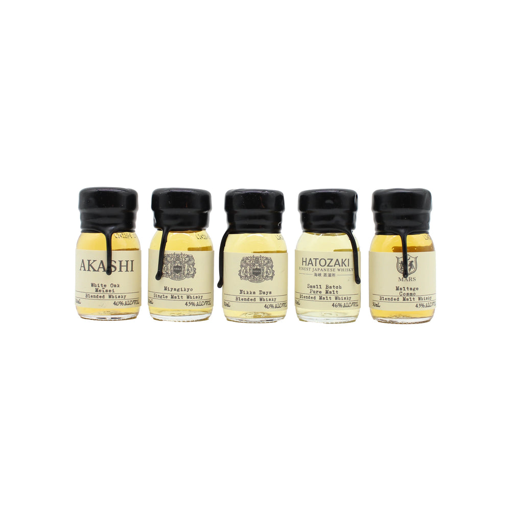 
                  
                    The Japanese Whisky Tasting Set features five small glass bottles with white labels, arranged in a row against a plain white background—ideal for an authentic Japanese whisky tasting experience.
                  
                