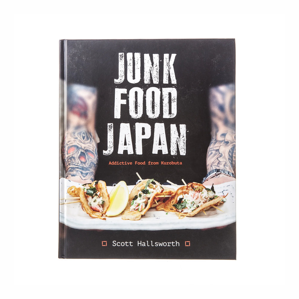 The cover of Junk Food Japan by Scott Hallsworth showcases inventive Japanese comfort food recipes, with tattooed arms visible in the background.