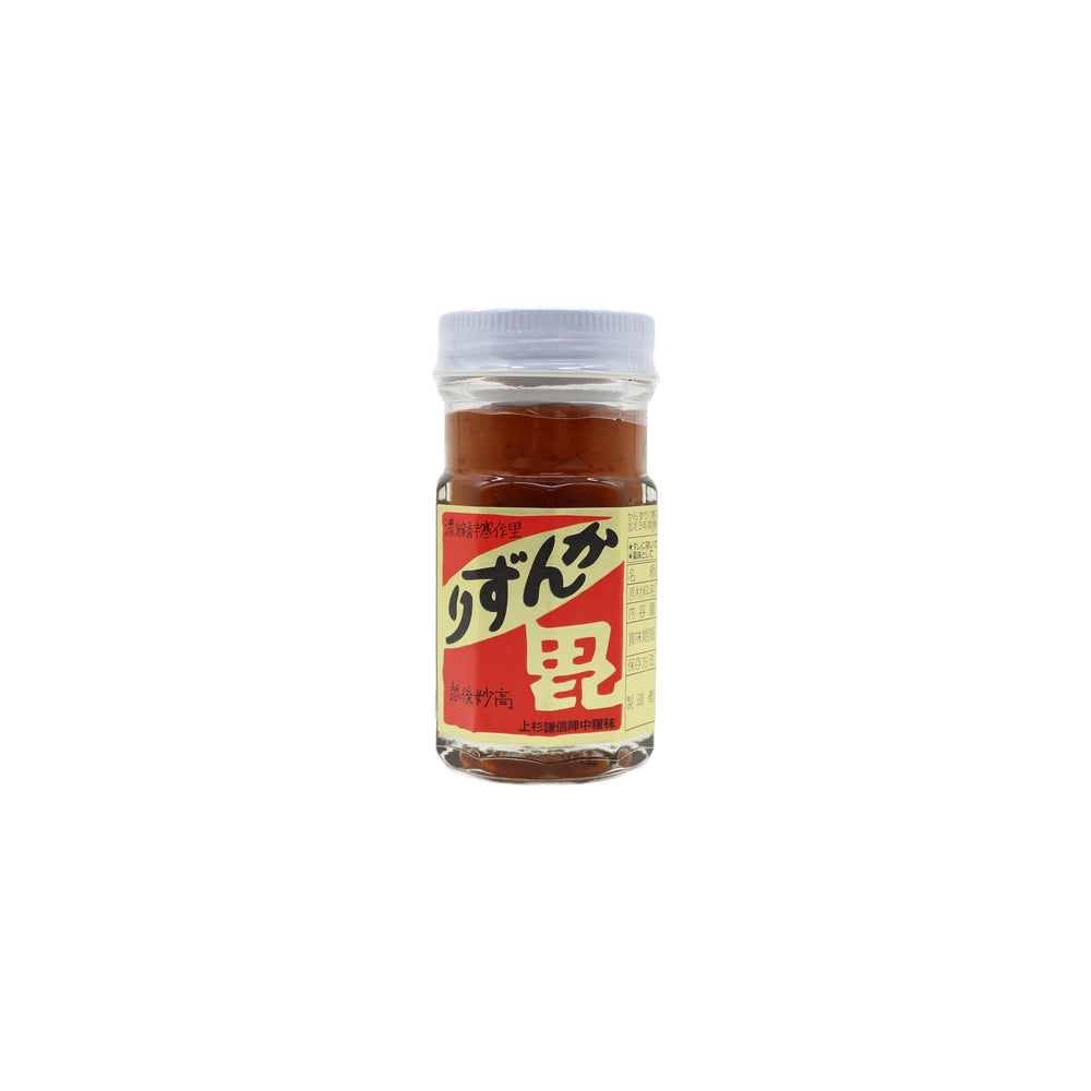 A 47g Kanzuri Fermented Chilli Paste in a small glass jar with a white lid, filled with reddish-brown paste made from fermented chili peppers, and featuring a yellow label with Japanese text.