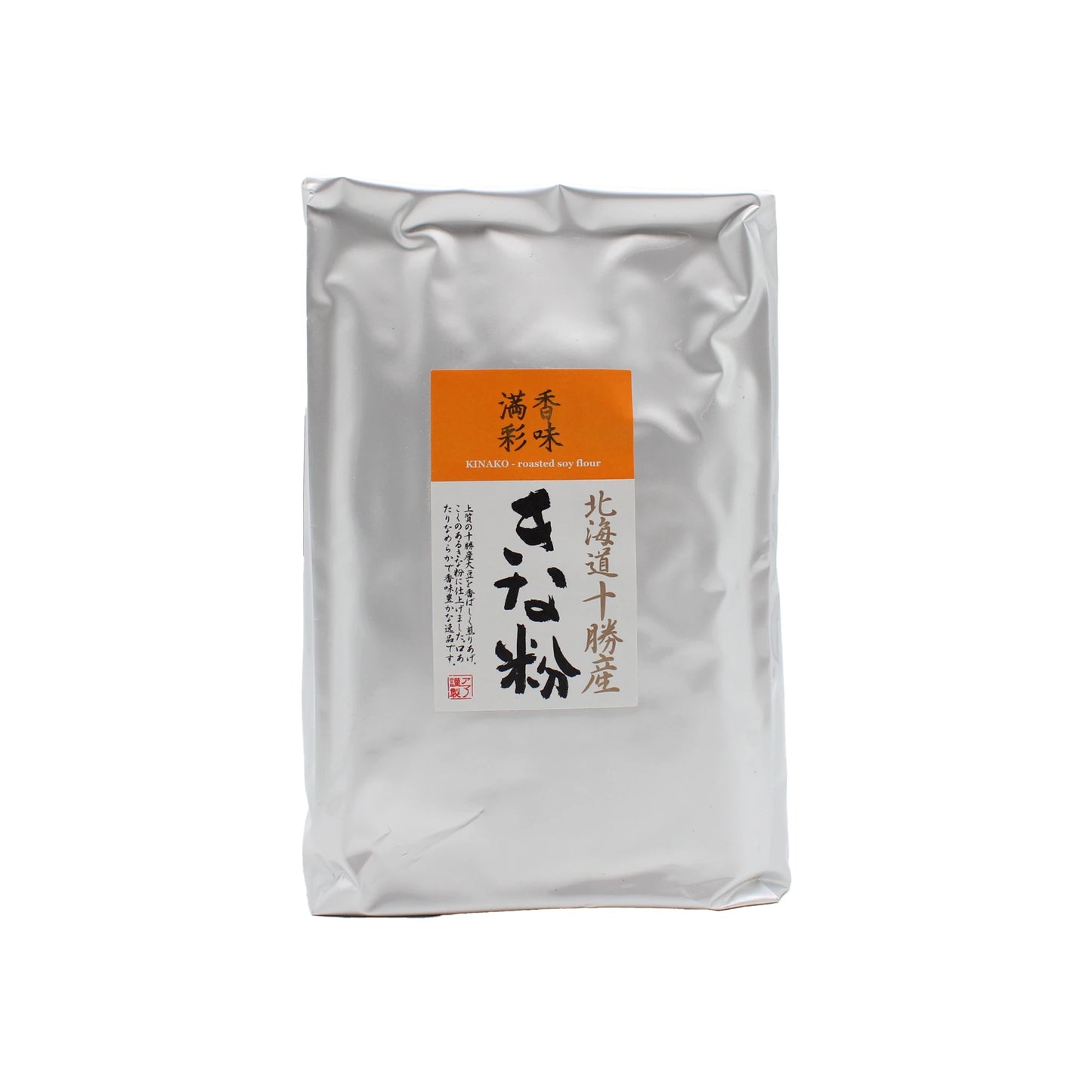 A sealed silver package labeled in Japanese with an orange section contains Kinako Roasted Soy Flour - 1kg, a Japanese roasted soybean flour commonly used in traditional desserts.