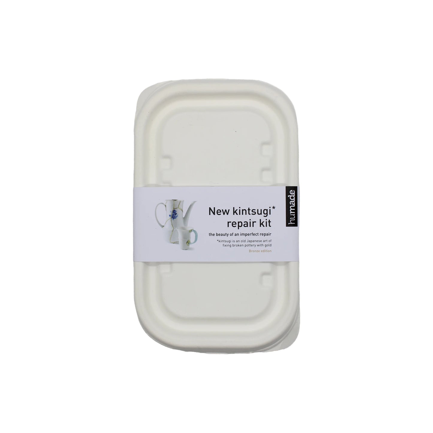 
                  
                    A white container labeled Kintsugi Kits - Gold, Silver & Bronze displays a repaired ceramic with a metallic finish, perfect for mending and transforming broken ceramics into unique pieces.
                  
                