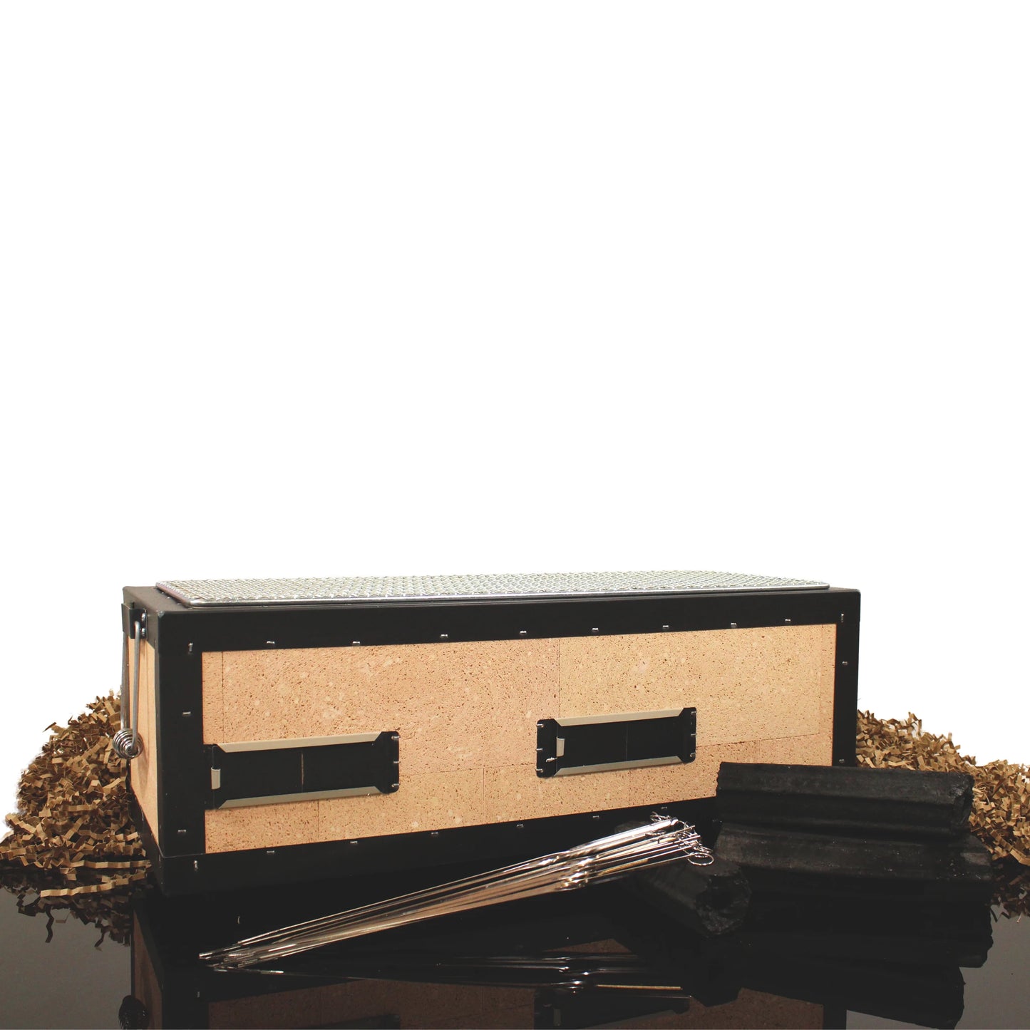
                  
                    The Konro Grill 54cm Barbecue Set is shown with black metal rods, rectangular blocks, and wood shavings, all arranged on a glossy black surface for a sleek, Japanese BBQ-inspired look.
                  
                