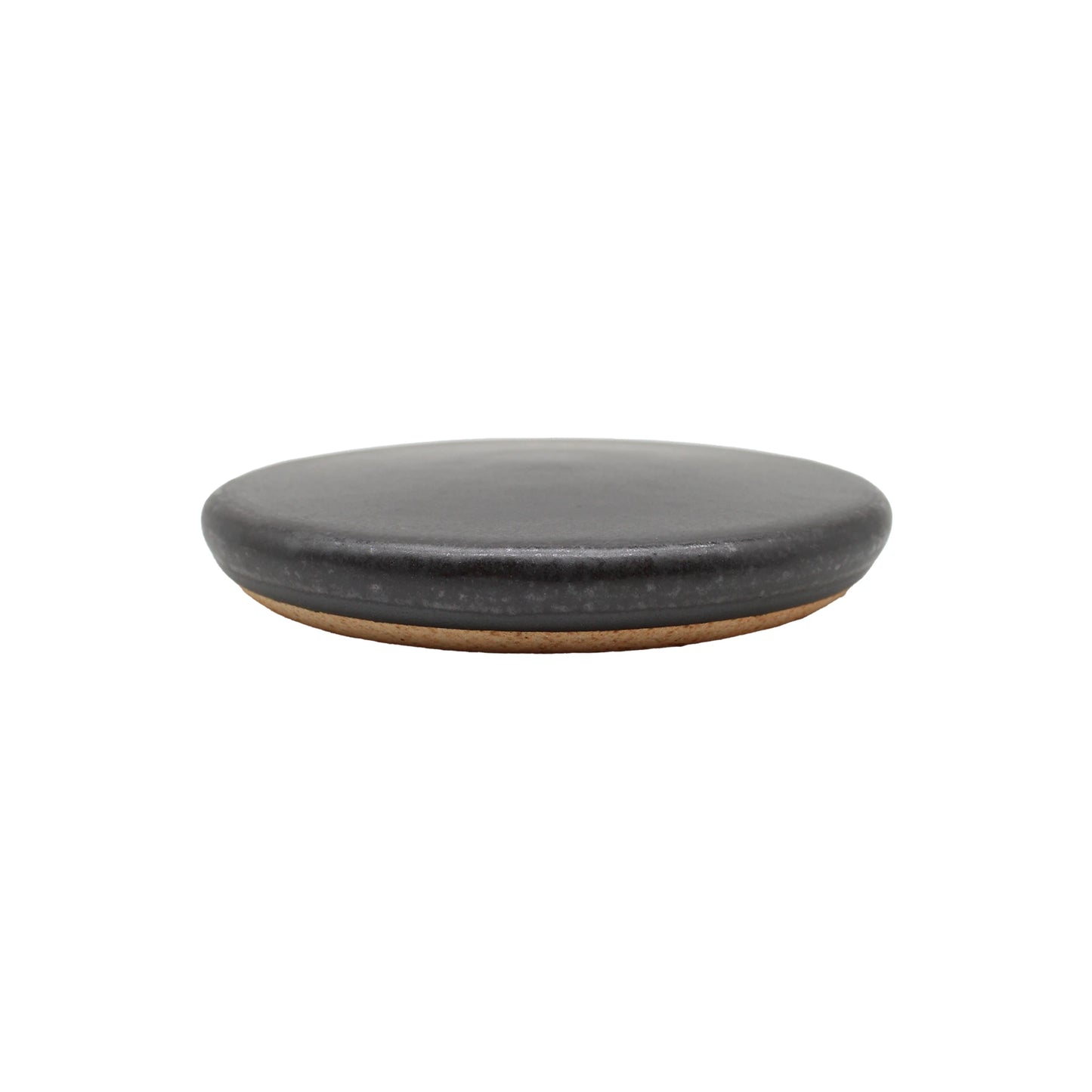 
                  
                    The Ishiyaki - Grilling Stone is a round, flat, dark gray ceramic plate with a slightly raised edge, resembling a volcanic cooking stone, displayed against a white background.
                  
                