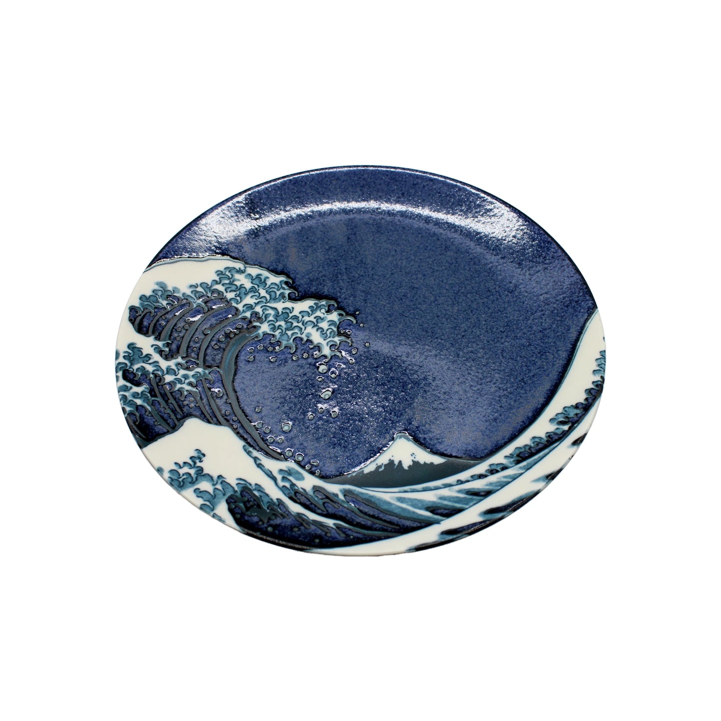 
                  
                    The Large Plate - Great Wave Design Blue is a Minoyaki porcelain plate featuring blue and white stylized waves and a distant mountain, inspired by the Great Wave off Kanagawa.
                  
                