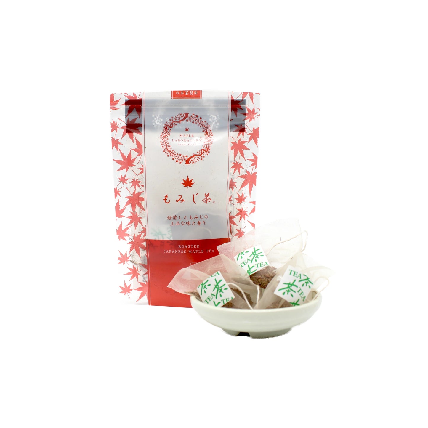 A Maple Tea Pack - 7 Tea bags with a red maple leaf design is displayed behind a small white bowl holding several pyramid tea bags, emphasizing the herbal tea’s antioxidant benefits.