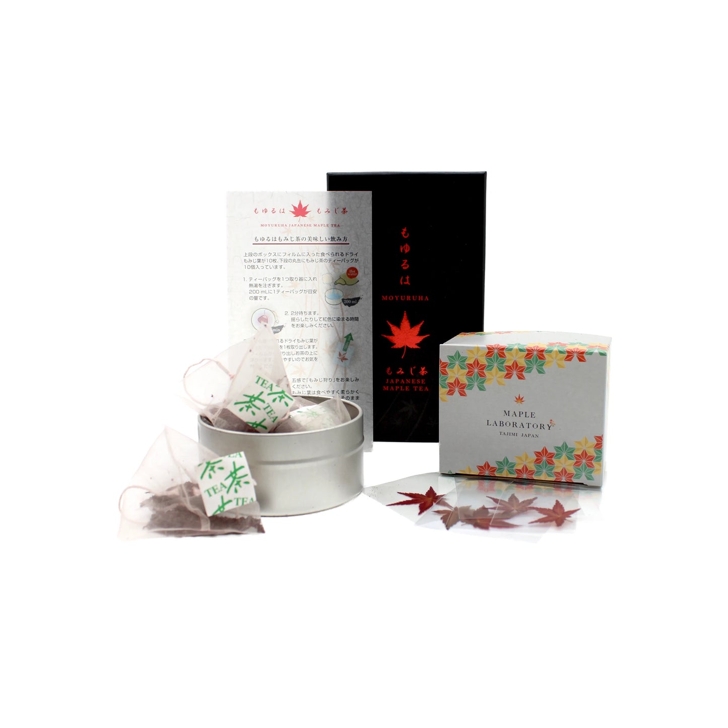 The Maple Tea Set includes 10 tea bags and 10 maple leaves, beautifully presented in a round tin with an instruction sheet, a black box, and a white box adorned with autumn leaves on a white background.
